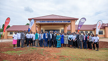 A group photo infront of the CORSU REHAB CENTRE CoRSU hospital hosts the launch of there new facility, the Rehab centre fully funded by CBM.